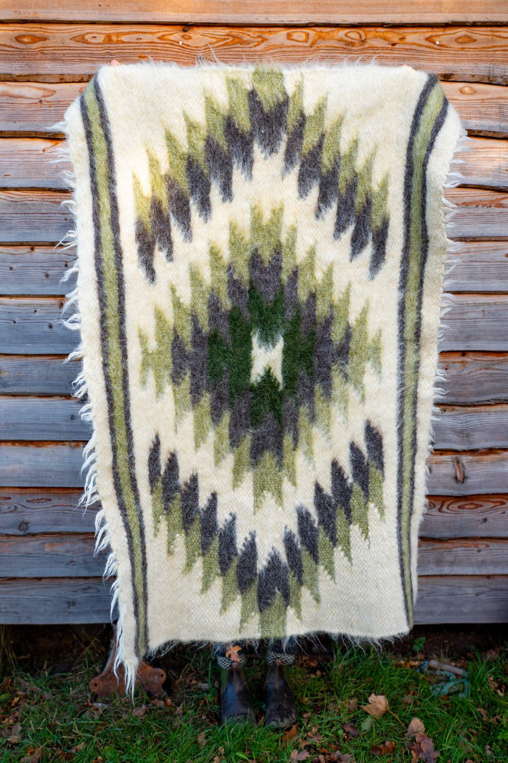 Handwoven wool rug with green diamonds., view 2